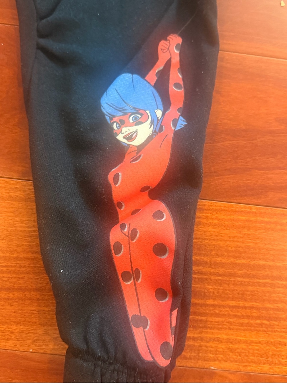 Ladybug Character Black Sweatpants with Red Polka-Dot Graphic